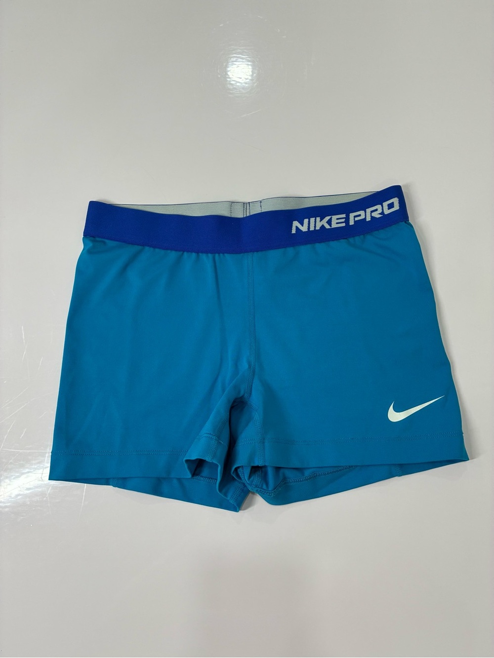 Nike Blue Athletic Compression Shorts with White Swoosh